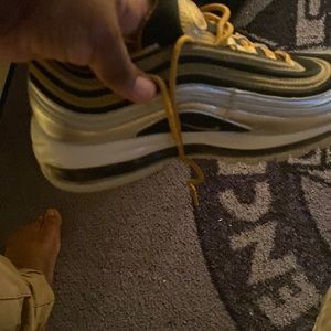 Nike brand silver and gold shoe used hood condition
